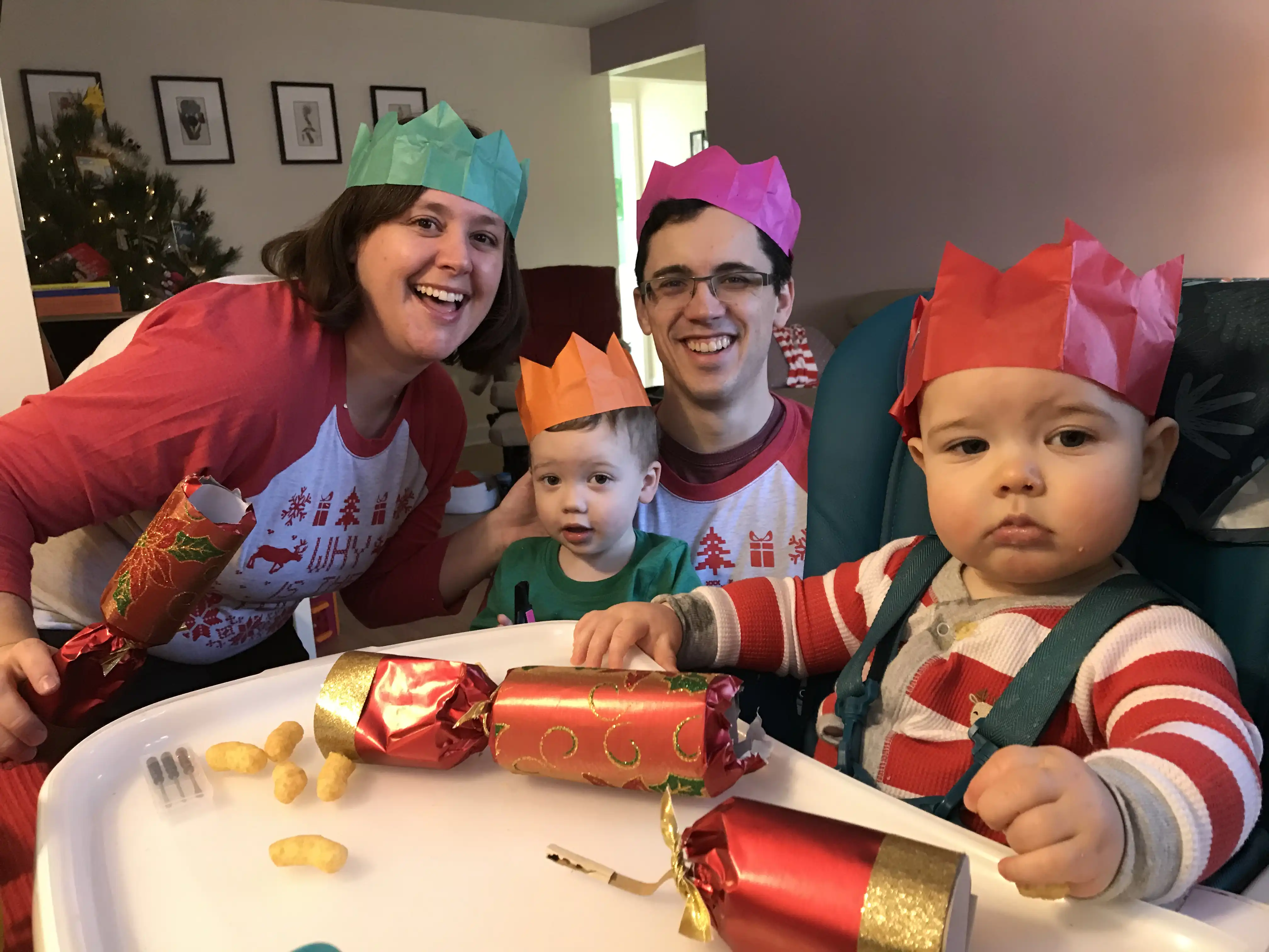 Amie, Alex, Graham, and Royal wearing Christmas crowns.
