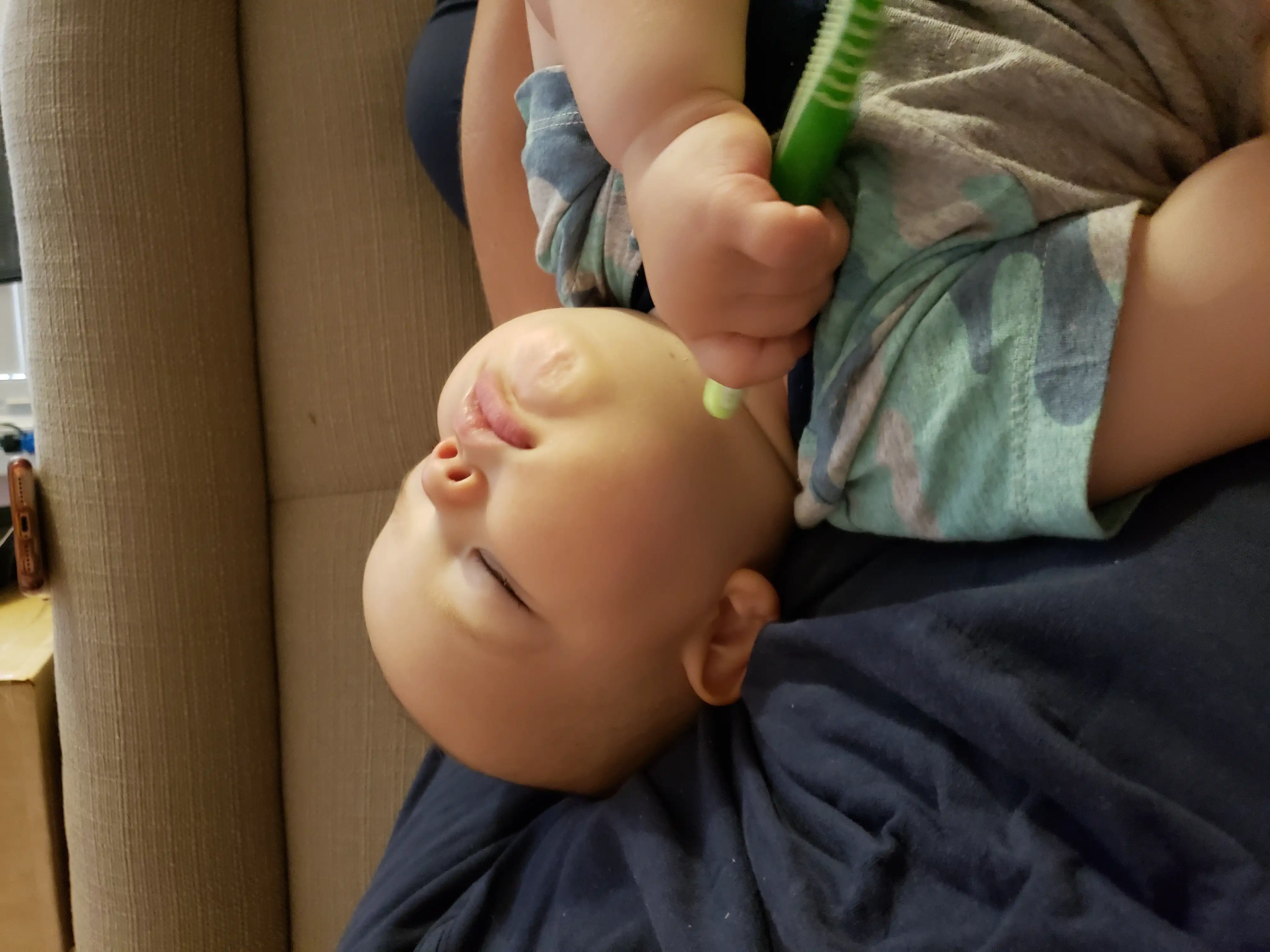 Our two-year-old Royal asleep with a toothbrush