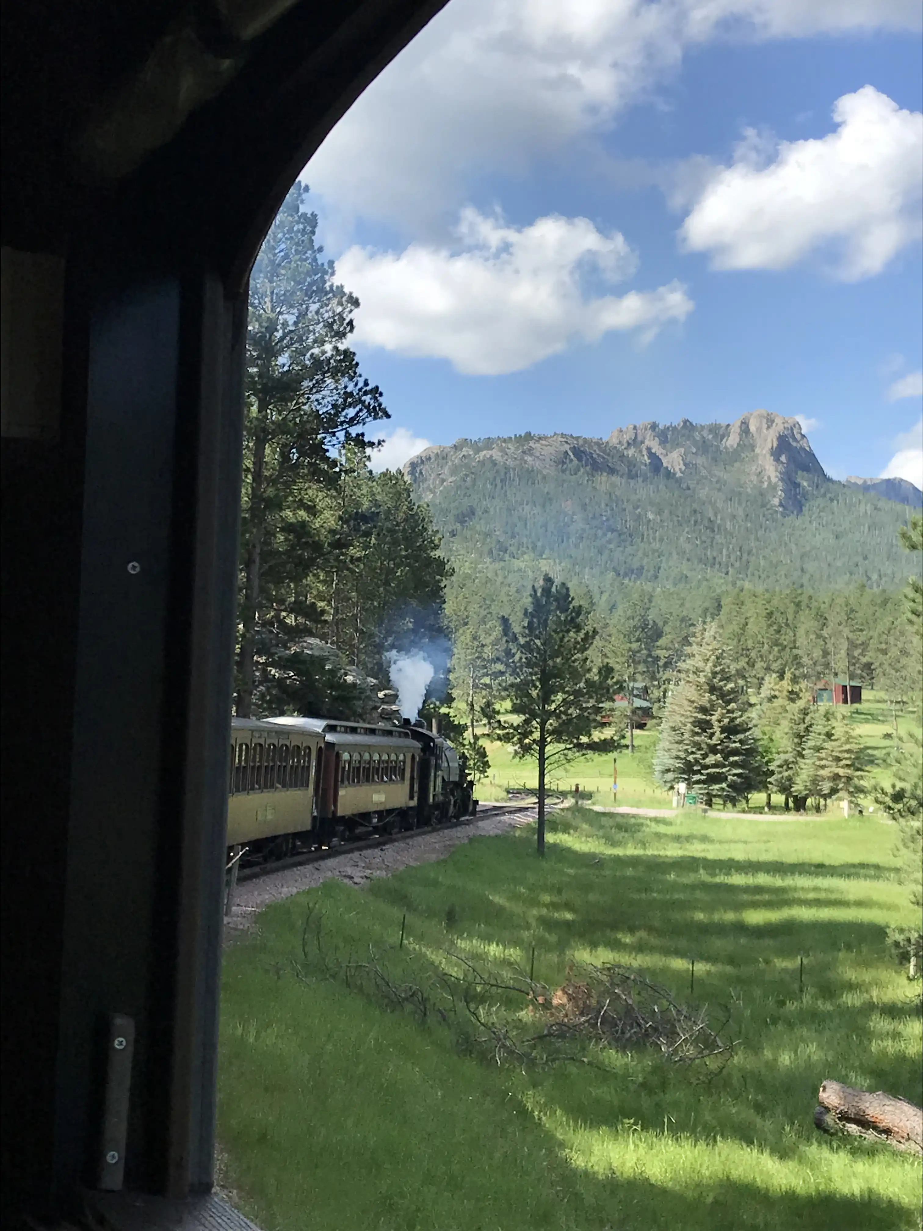 The 1880 train, with the Black Hills in the distance.