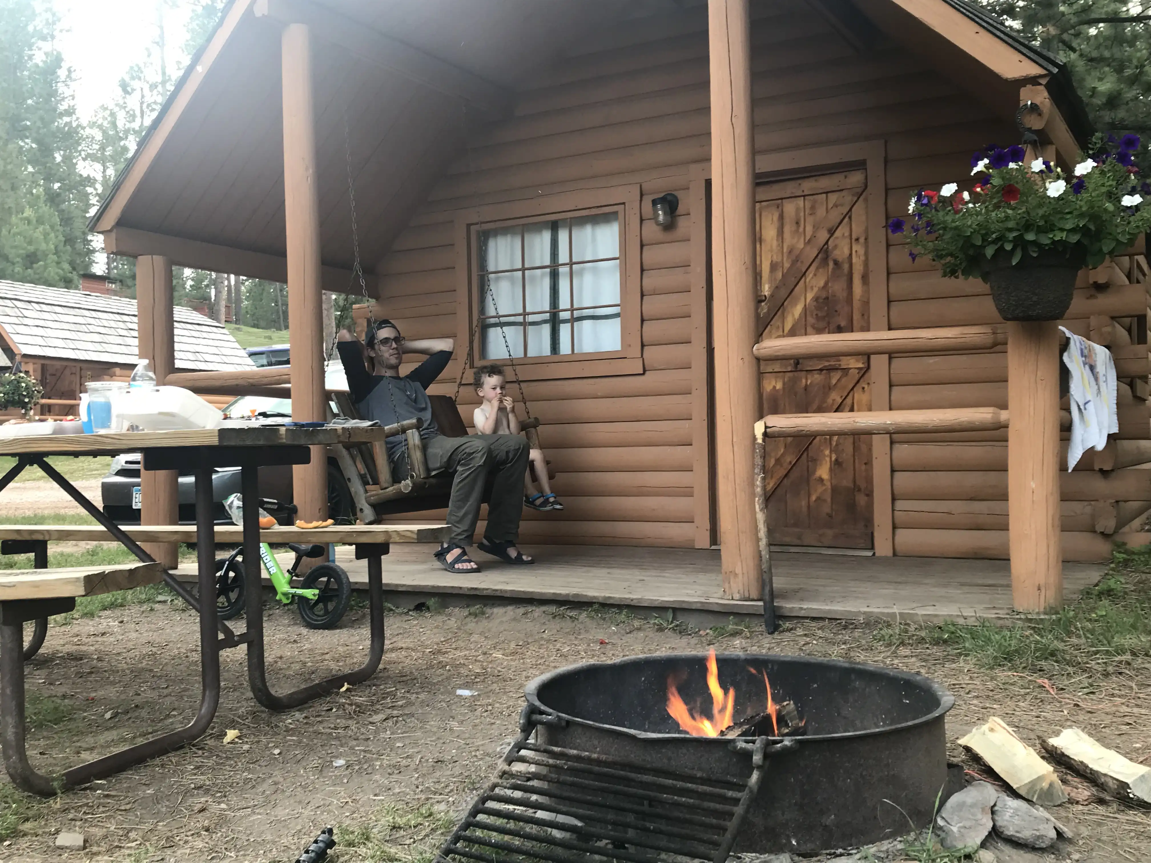 Graham and Alex lounging outside our cabin.