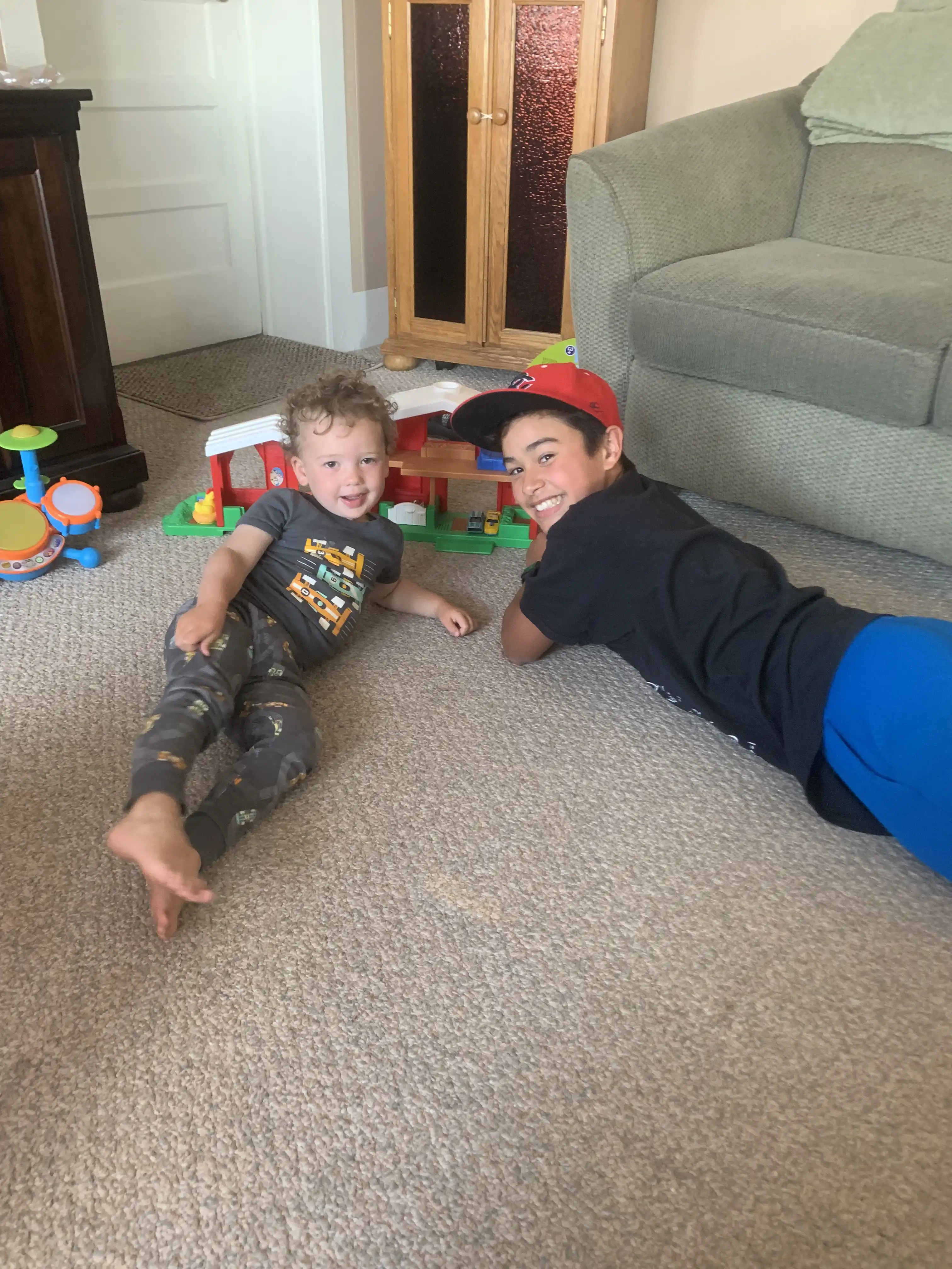 Graham and Ty playing on the floor at Grandpa's house.