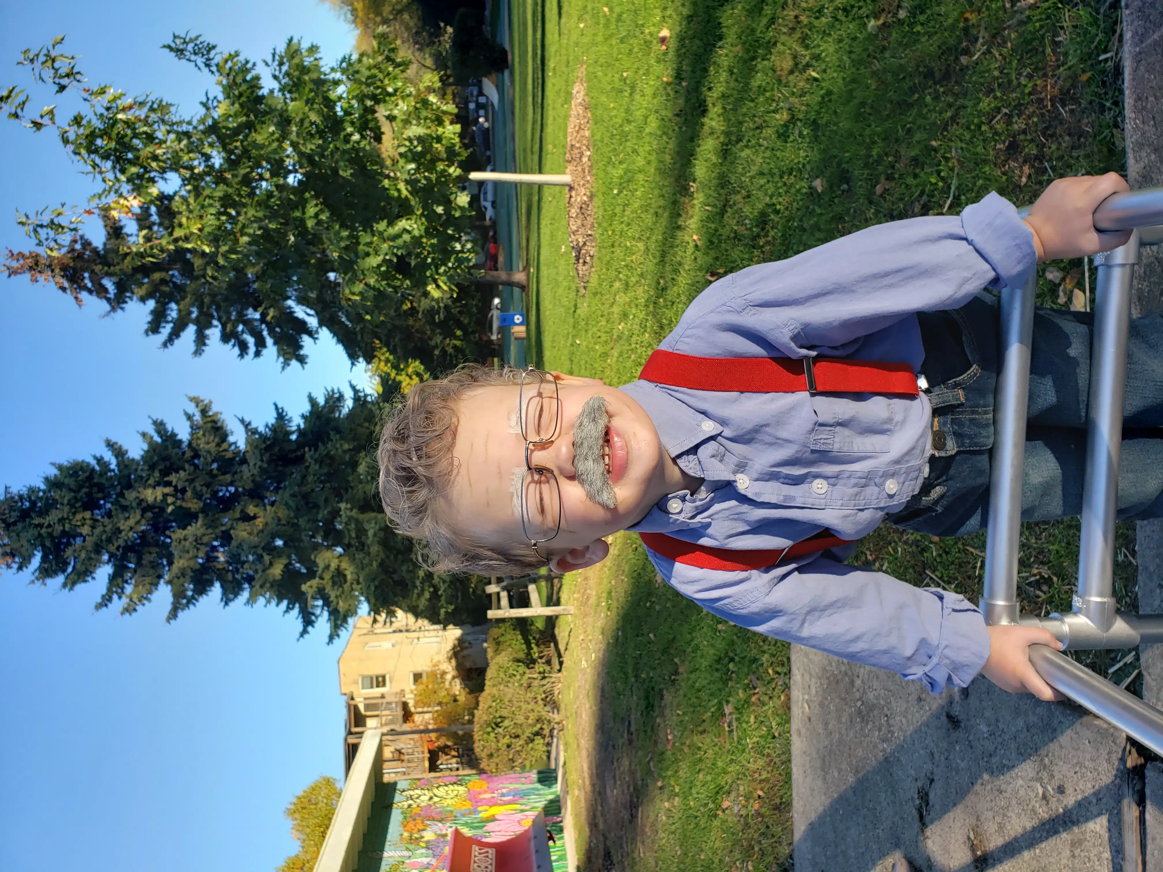 Graham wearing his old man costume, complete with grey hair, bushy grey moustache and PVC walker.
