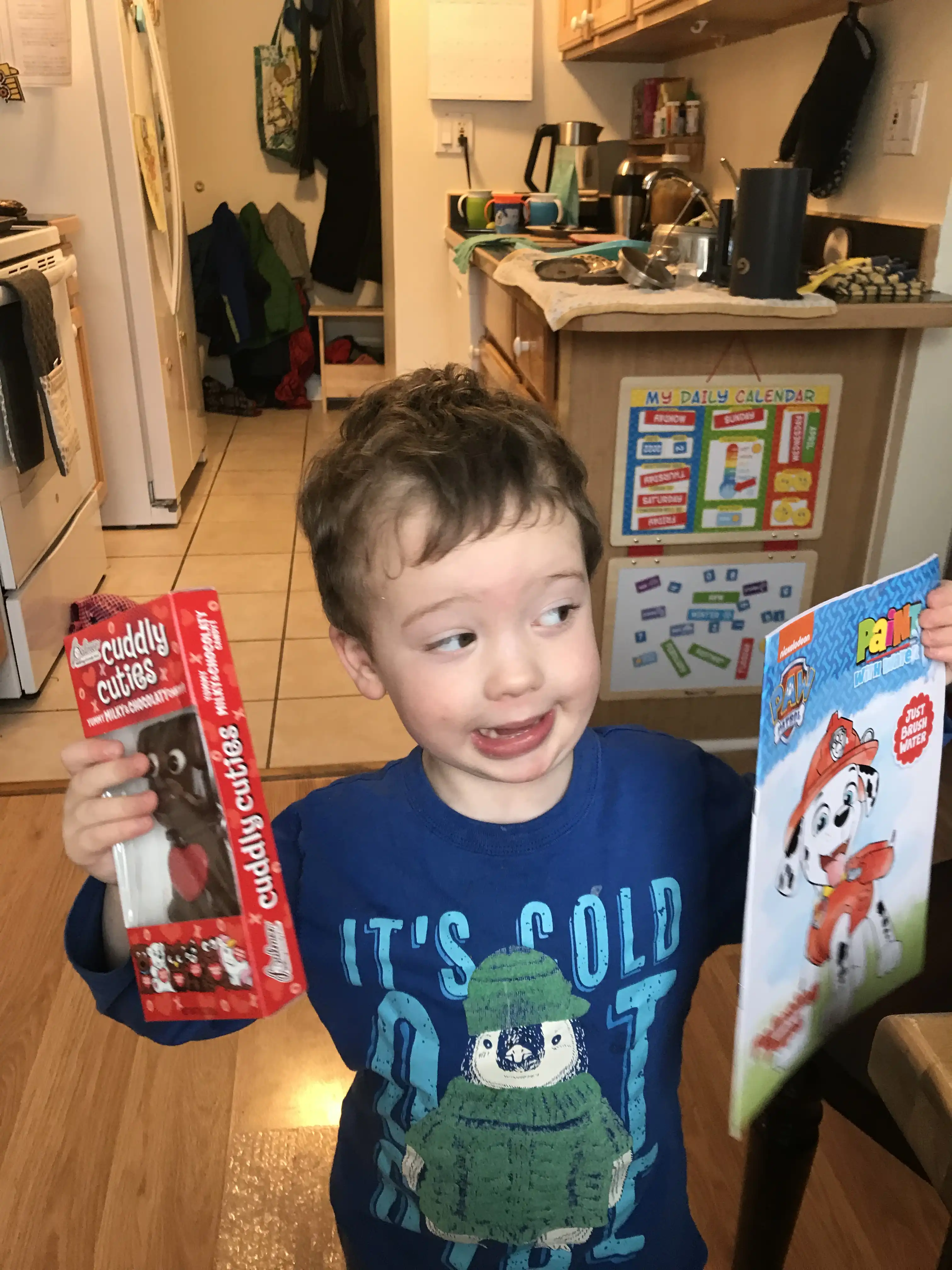 Graham holding up hos Valentine's day gifts.