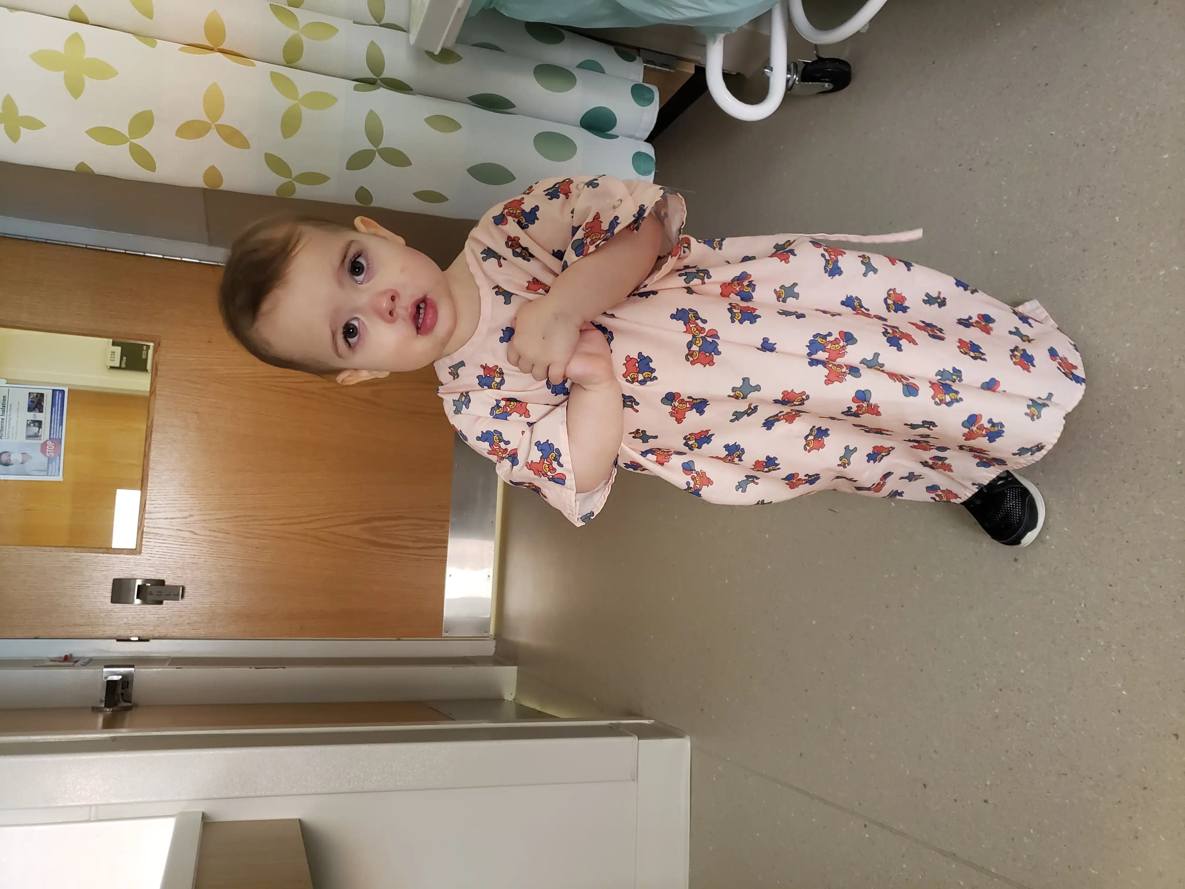 Royal in a hospital room gown.