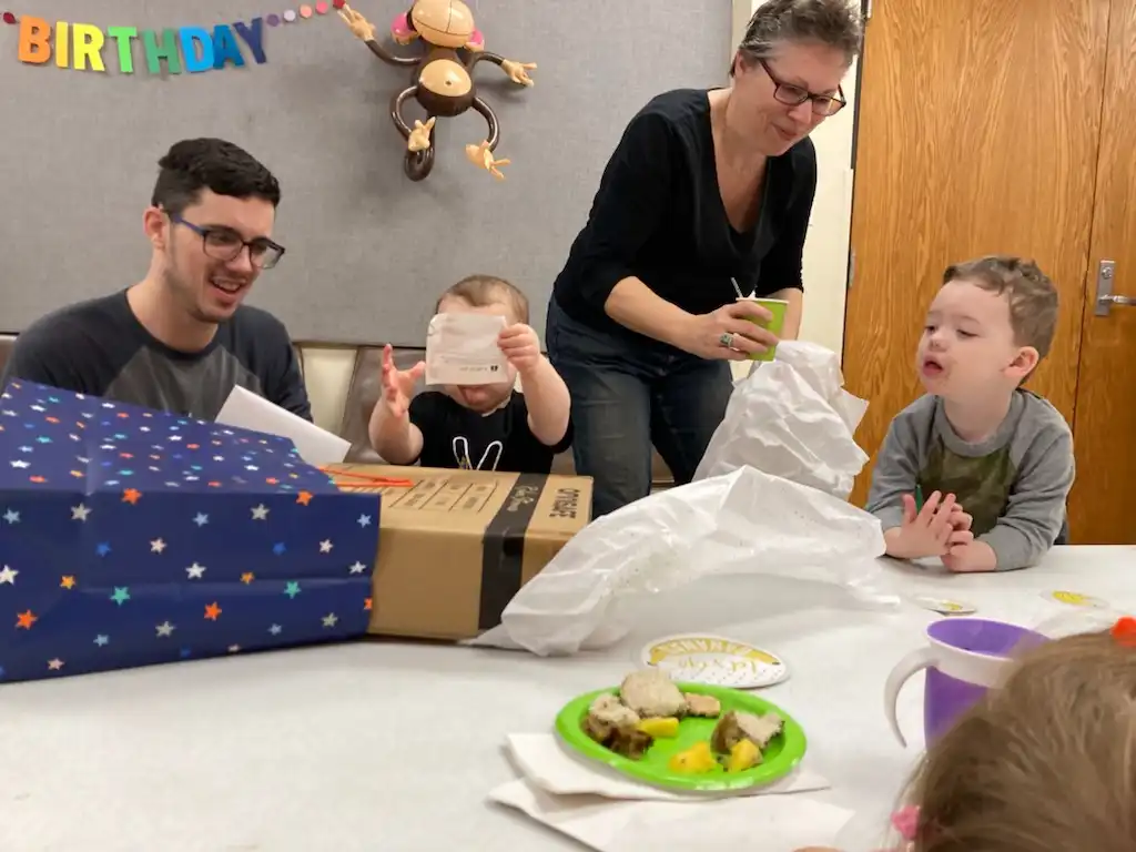 Alex, Royal, Kati and Graham at the birthday table. Royal's face is covered up.