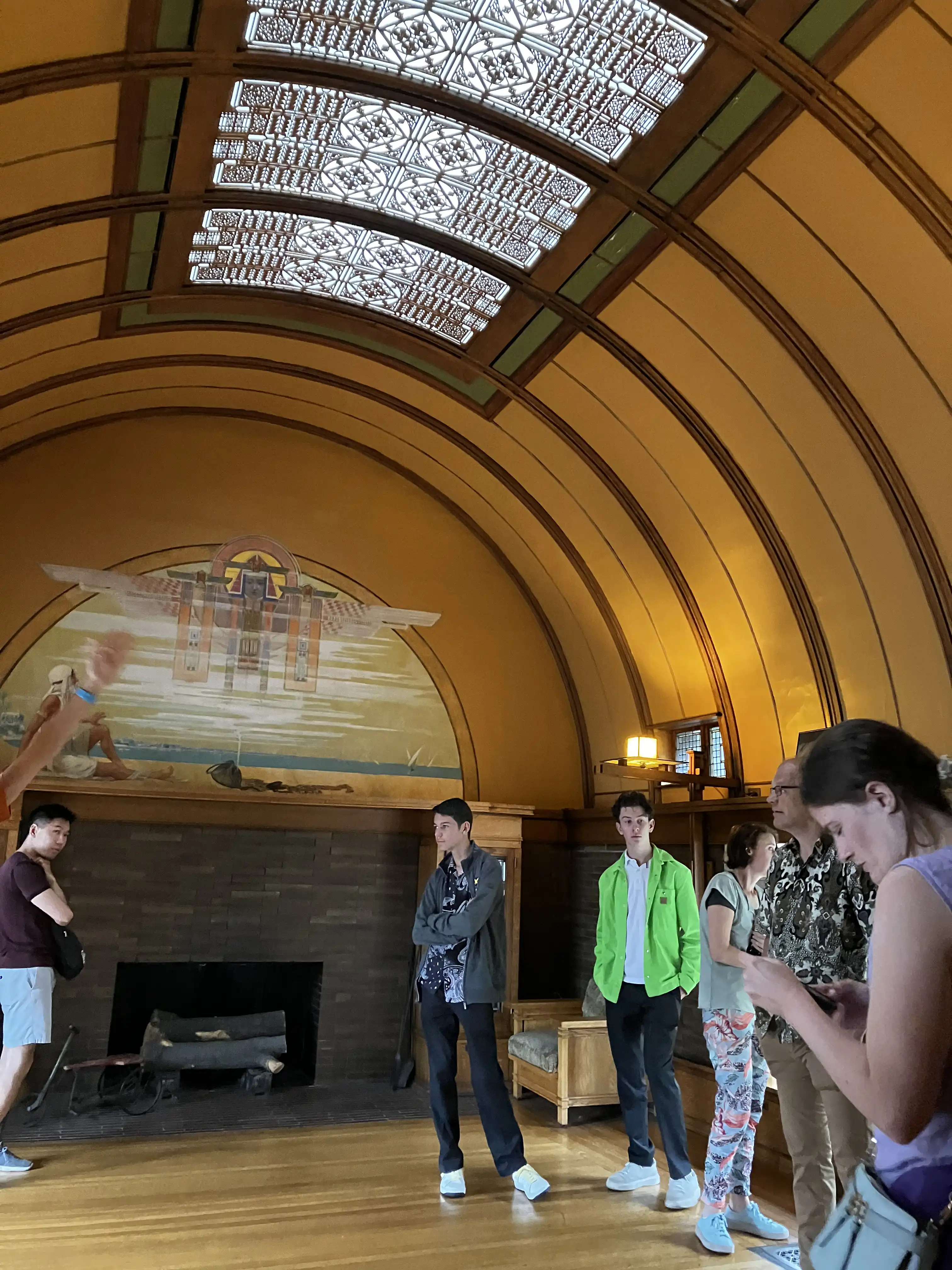 Wright's children's play room. Arched ceiling with stained glass roof and Egyptian mural on the far wall over a fireplace.