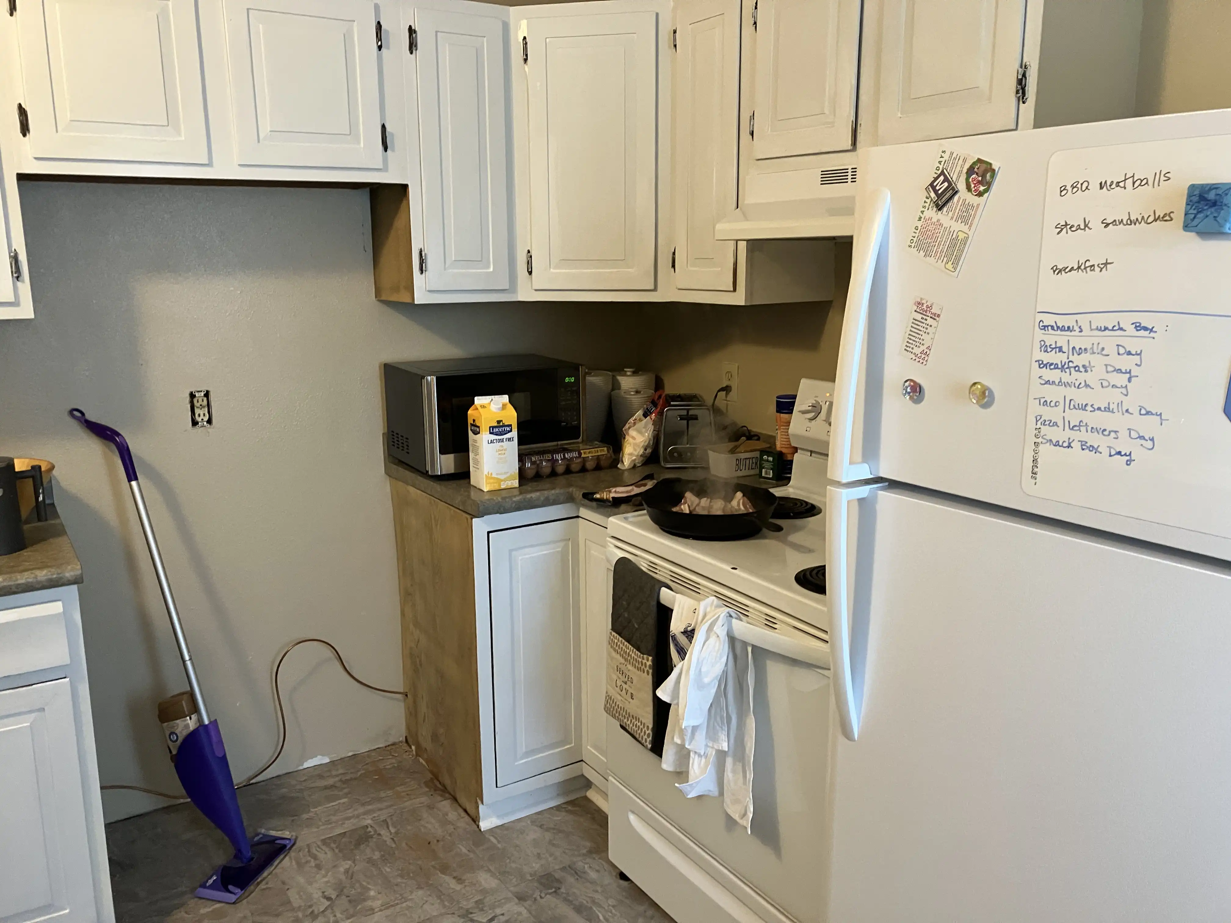 Kitchen with the refrigerator moved from the center to the right.