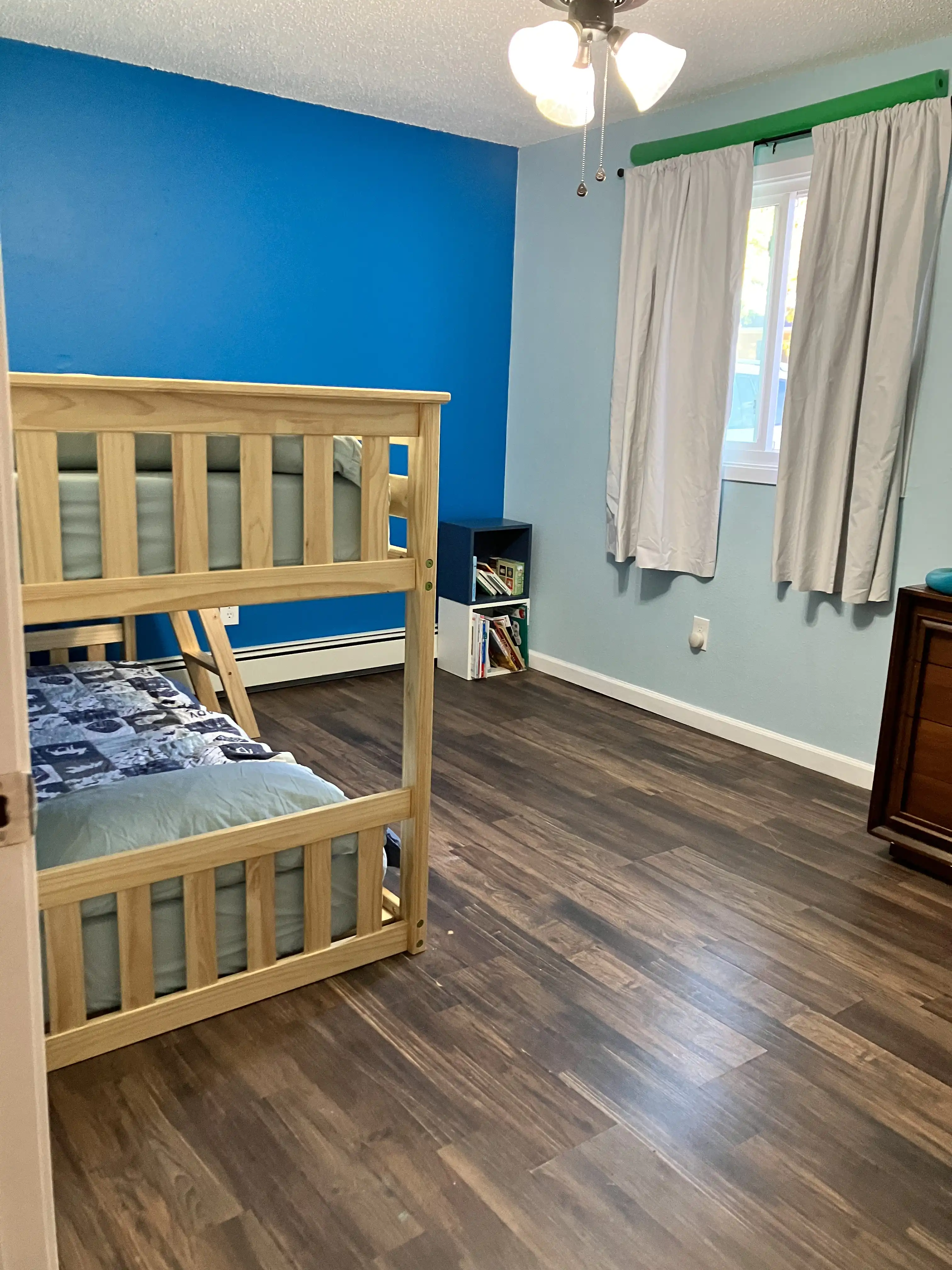 Graham and Royal's bedroom with freshly coated blue walls.