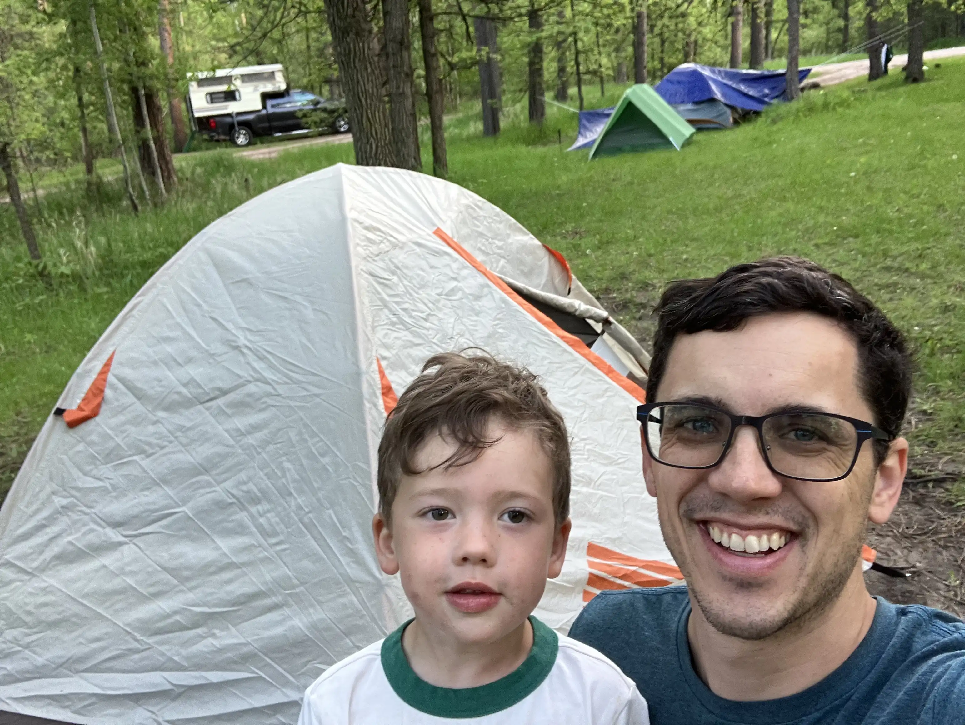 Graham and Alex in front of their tent at Grizzly Bear Primitive campsite #10.