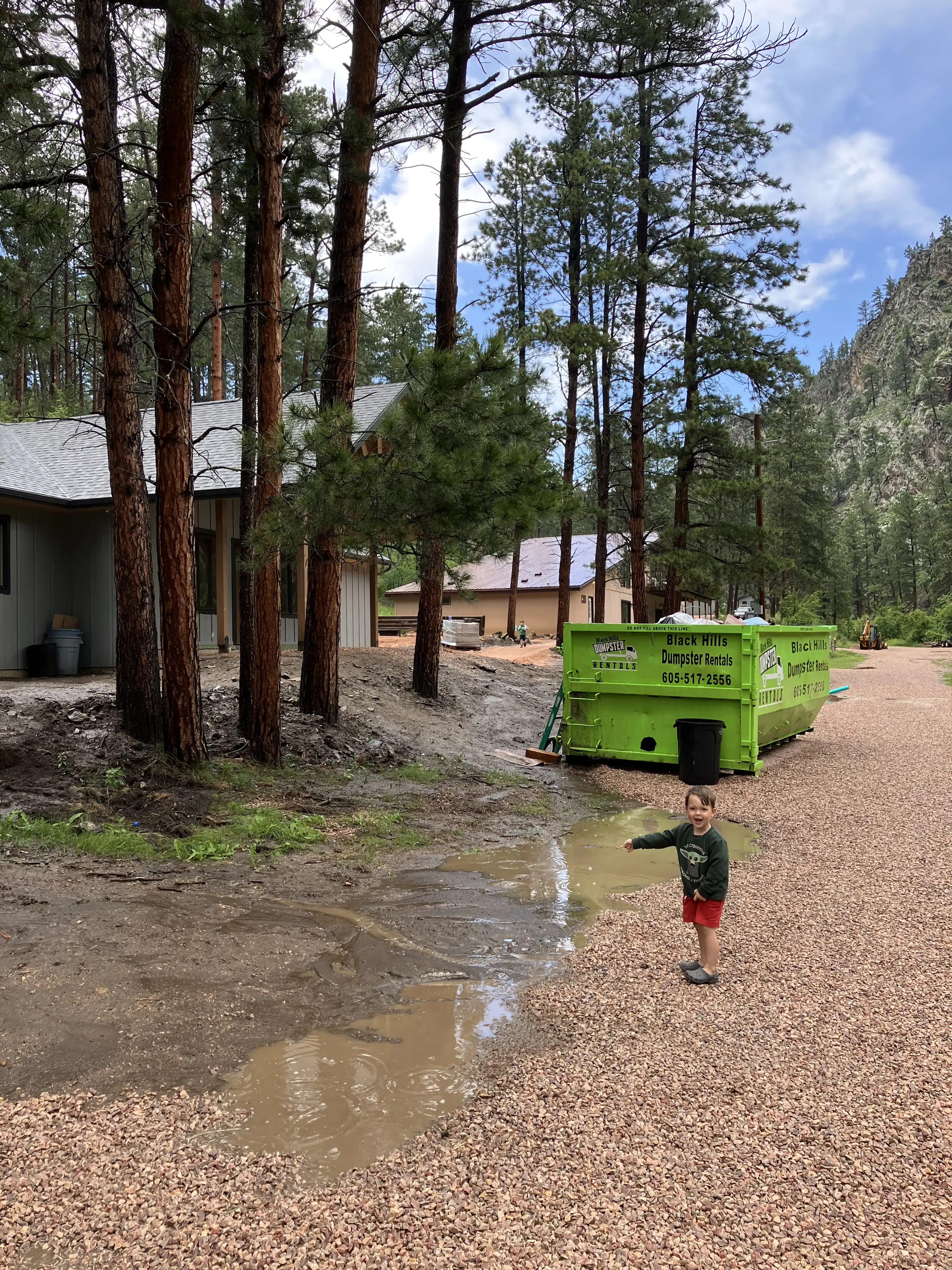 Royal pointing at a huge mud puddle at the camp.