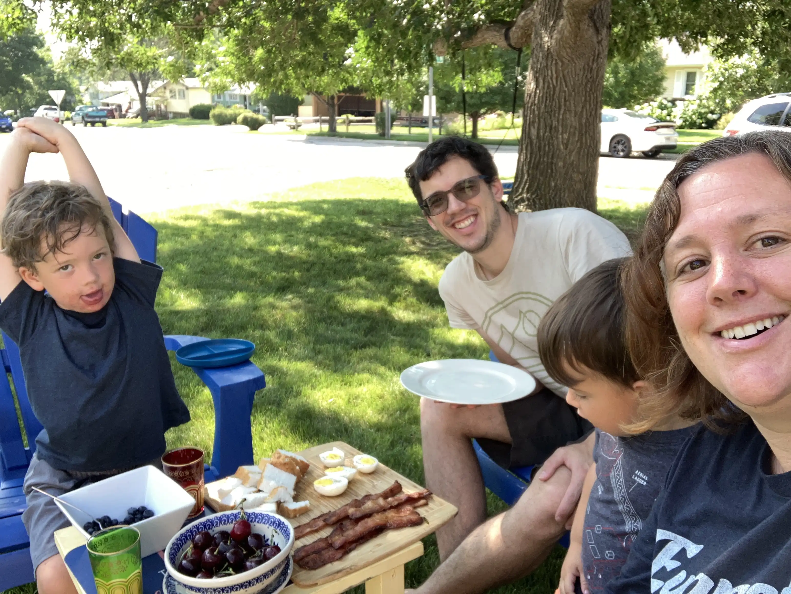 Amie, Alex, Graham and Royal enjoying a family feast outside under the Ash tree.