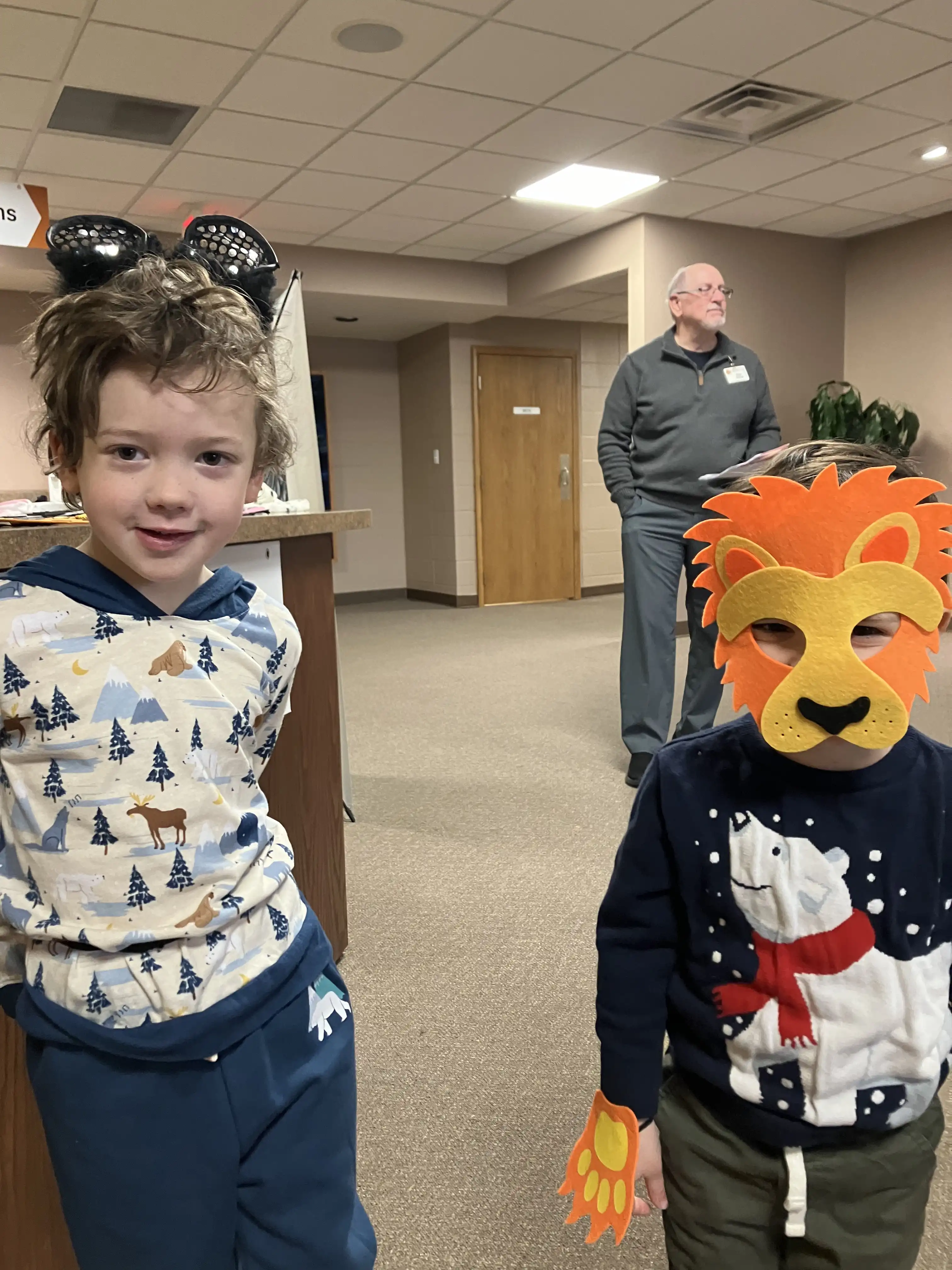 Graham and Royal dressed up as a panther and a lion