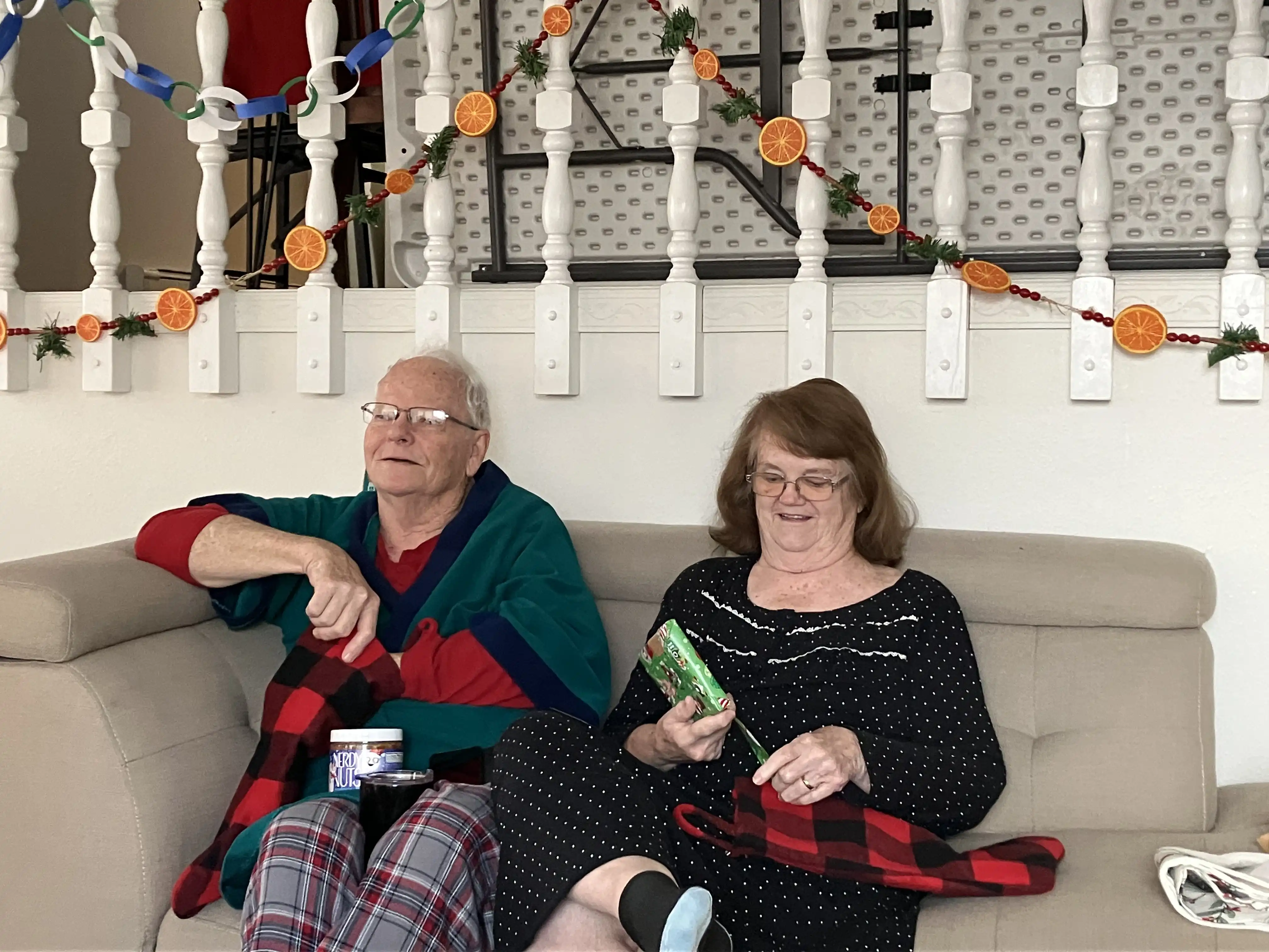 Nanny and Papaw opening their Christmas stockings