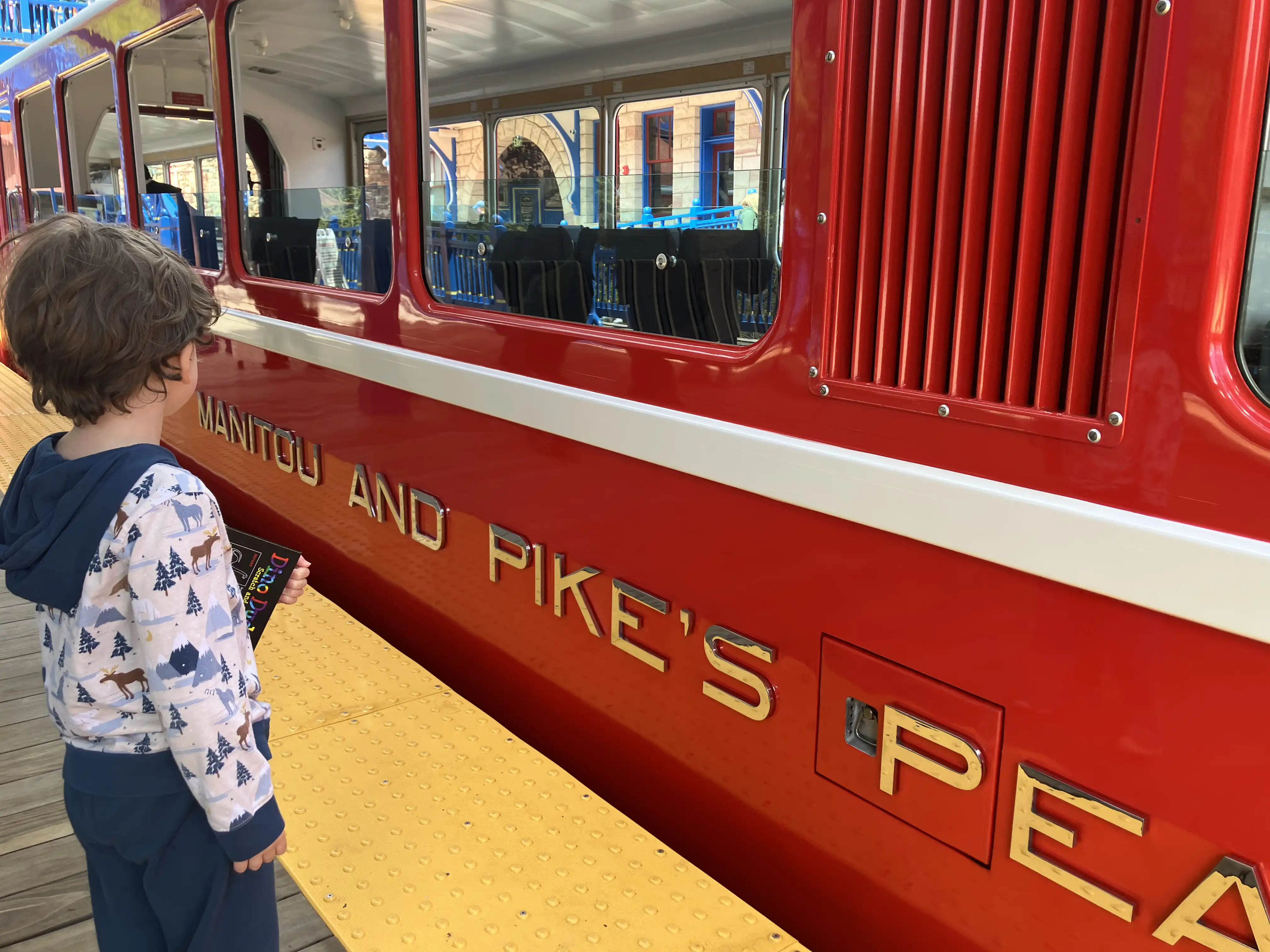 Graham standing outside the red Pike's Peak tram