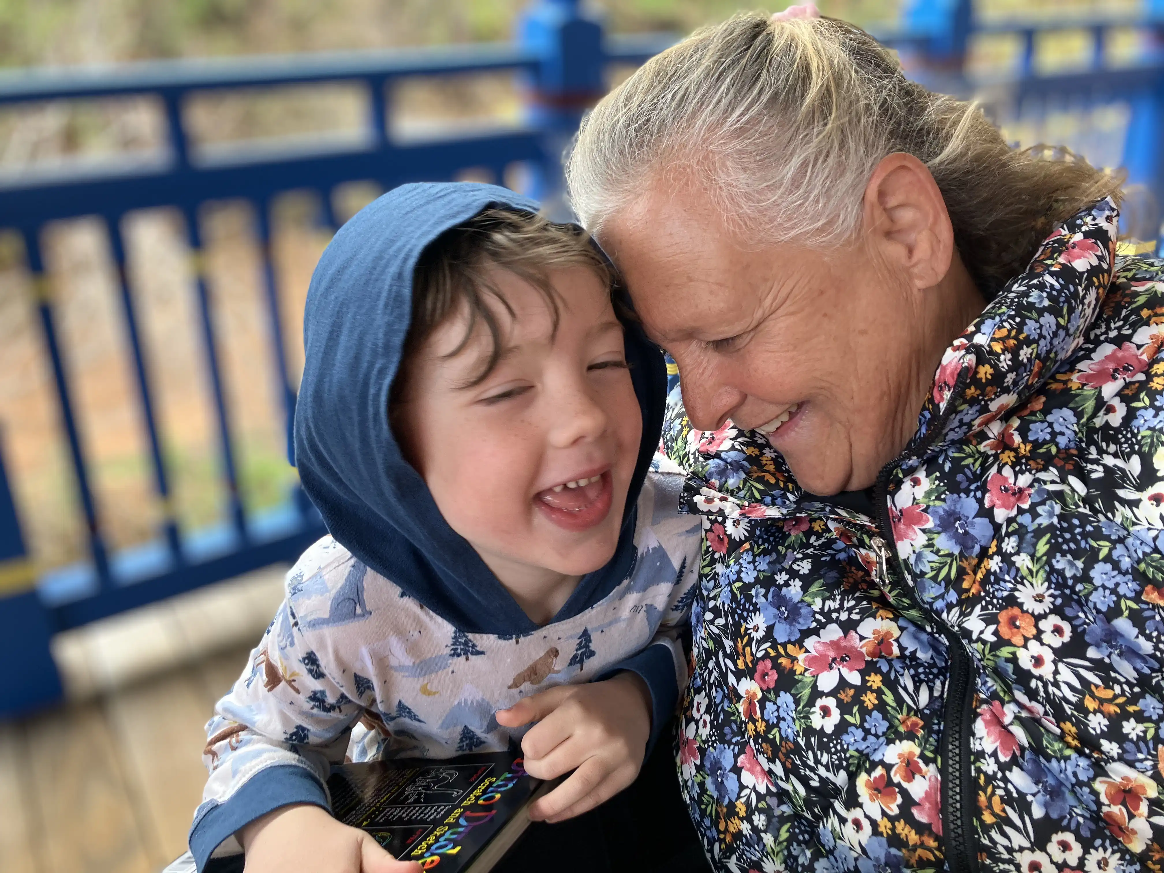 Graham and Grandma laughing and snuggling