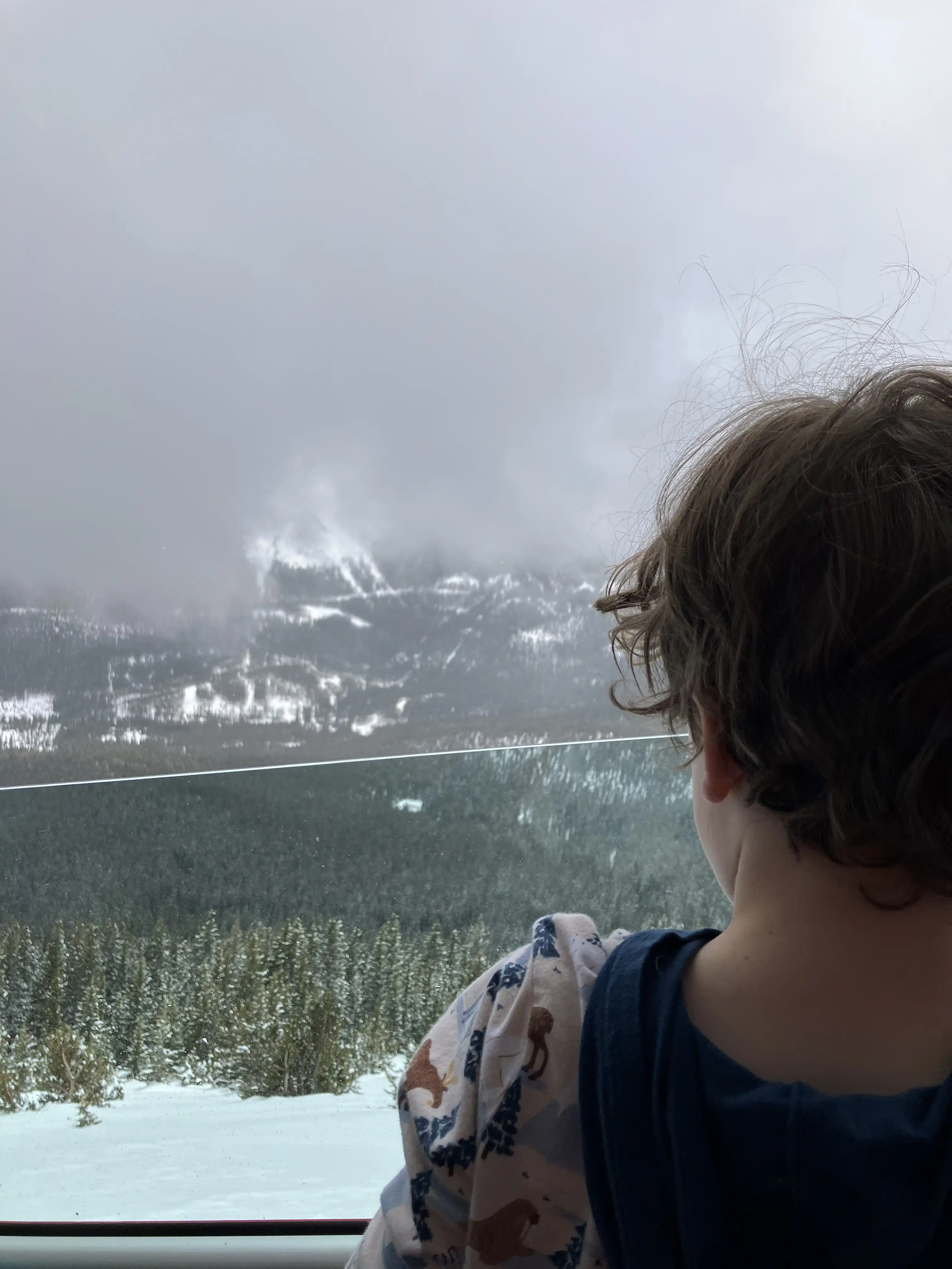 Graham looking down the snowy slope of Pike's Peak