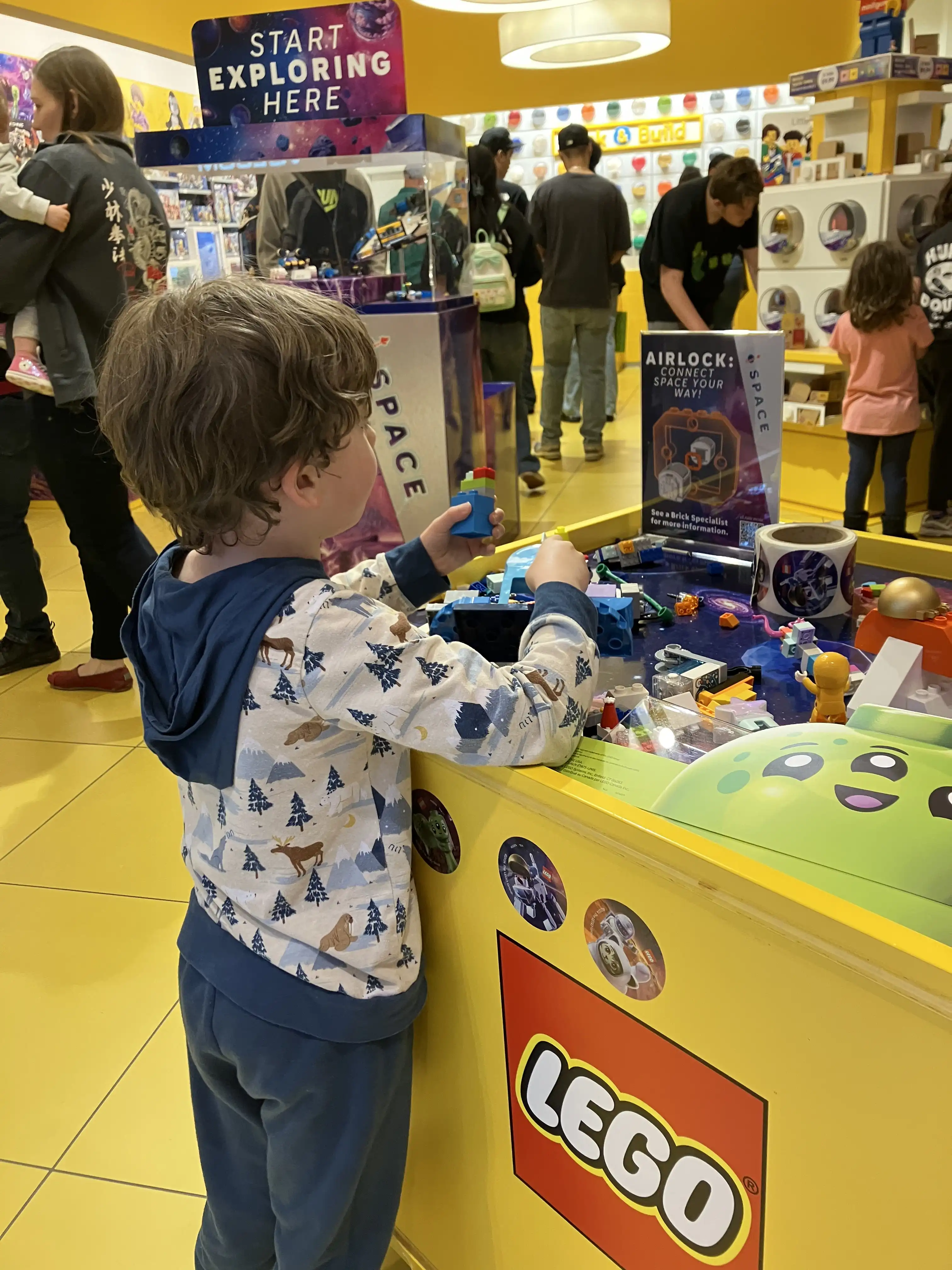 Graham at a counter in the LEGO store