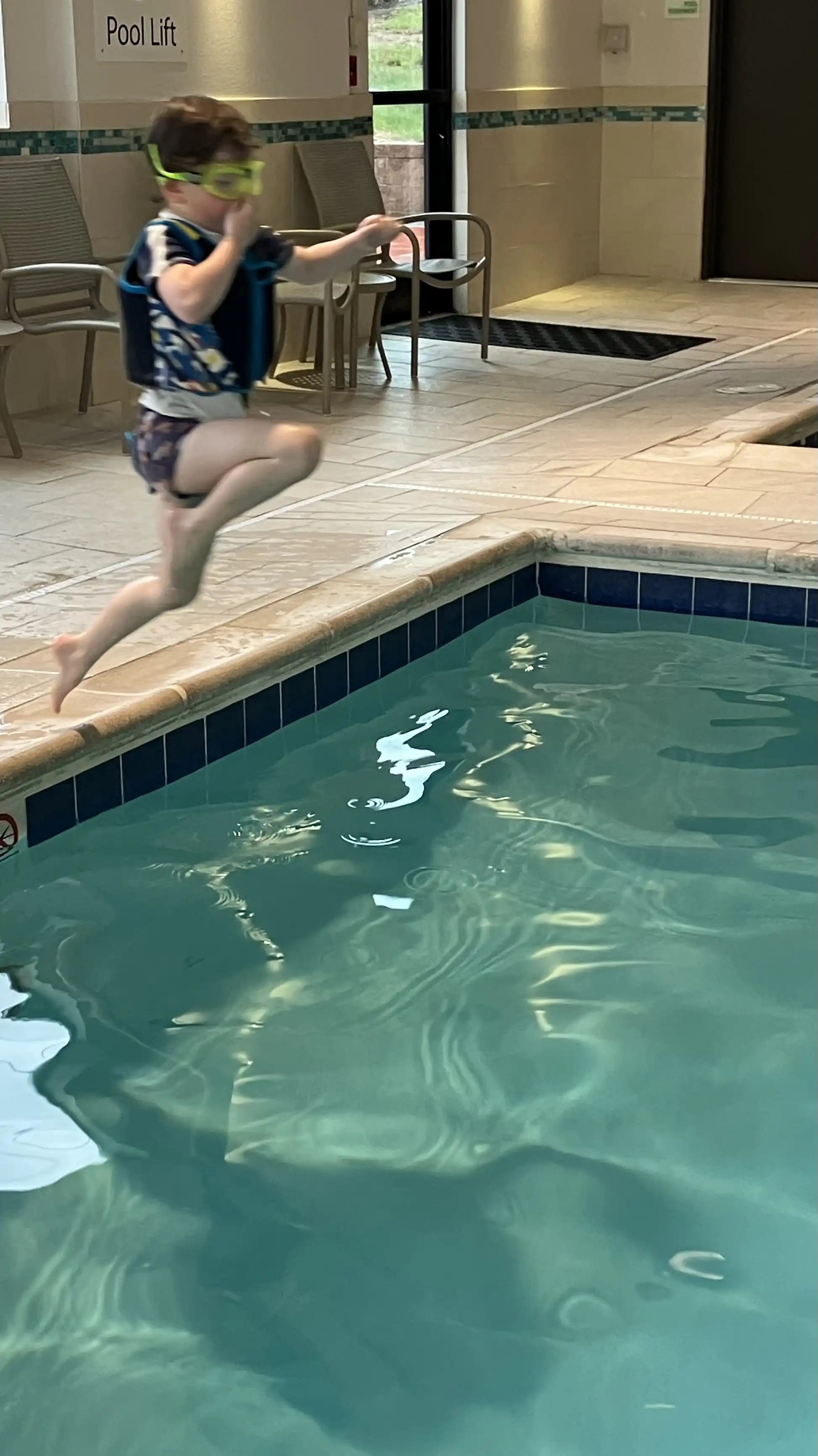Graham in a mid-air jump into a pool