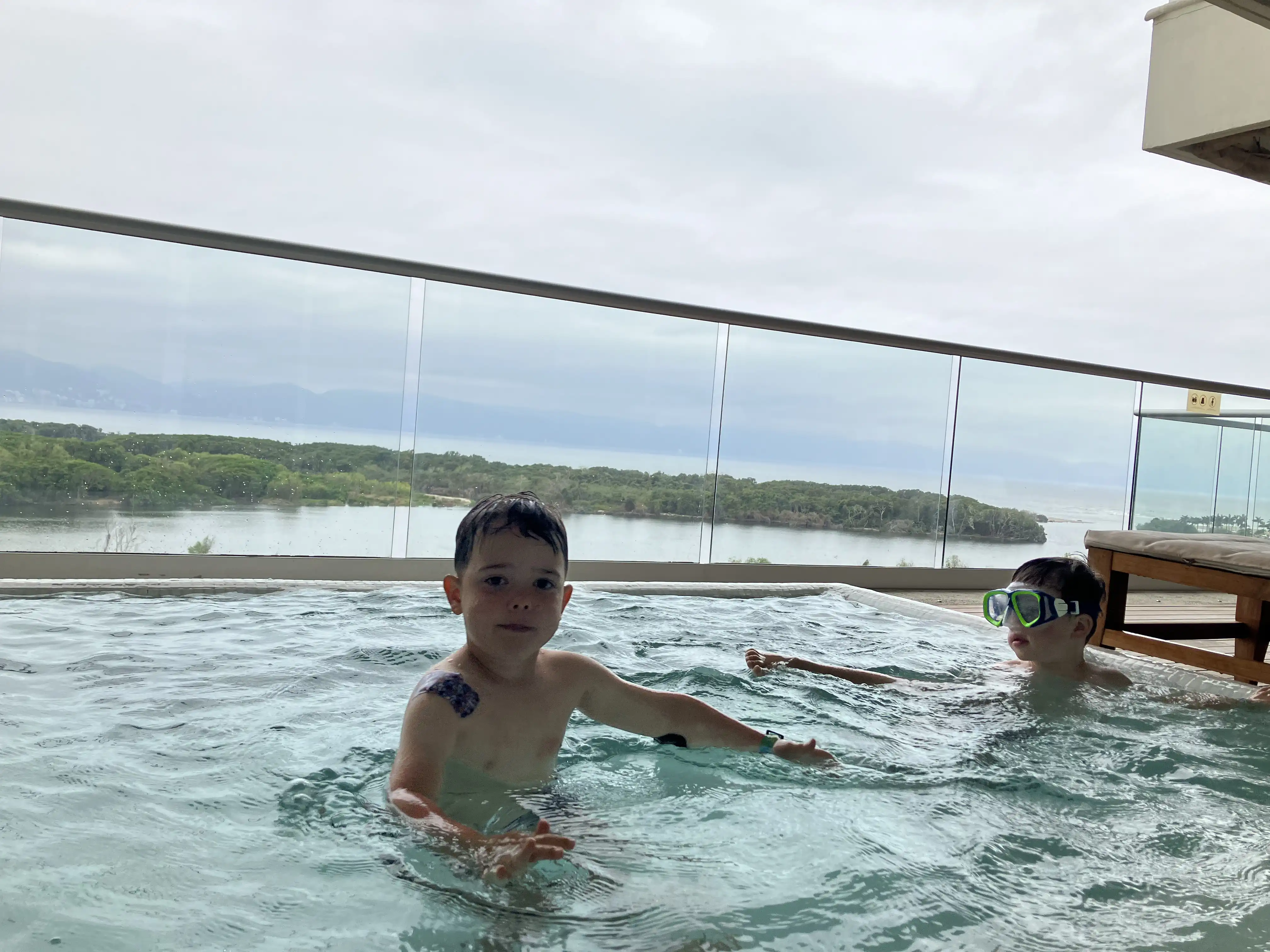 Graham and Royal in the deck pool attached to our shared suite.