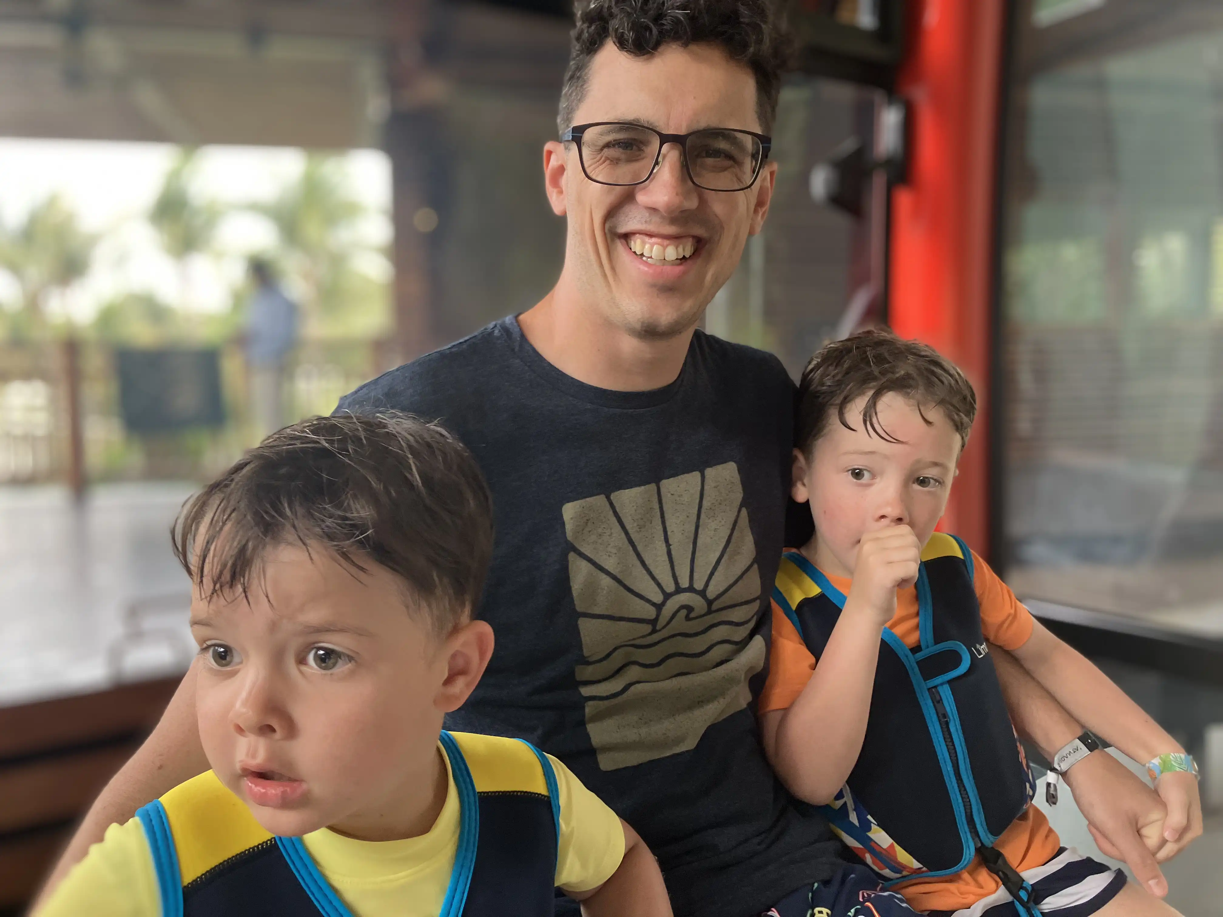 Alex, Graham and Royal posing for a picture inside a gondola.