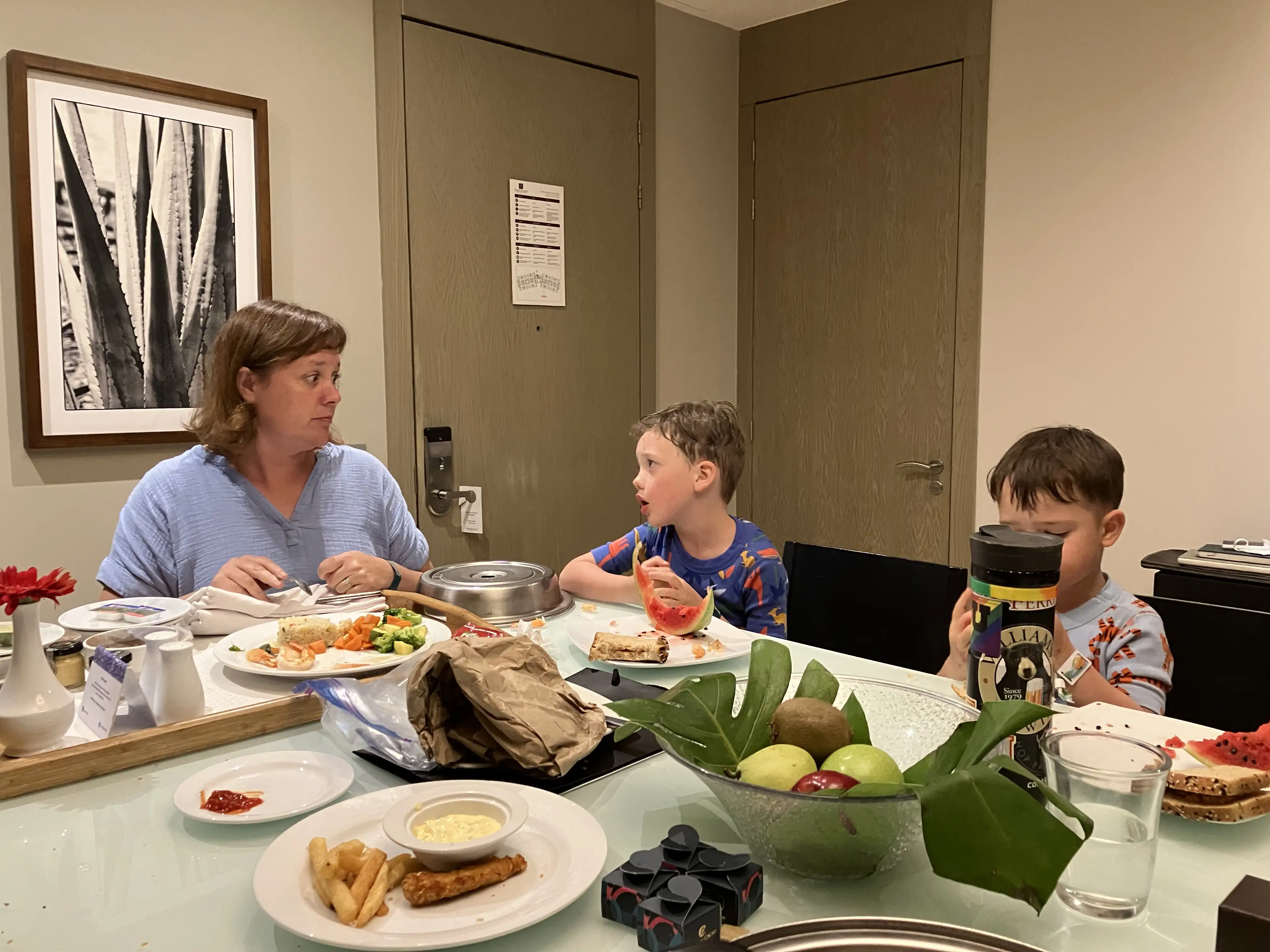 Amie, Graham and Royal eating at the kitchen table.
